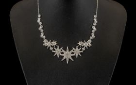 Swarovski Crystal & Rhinestone Necklace with three central star shapes surrounded by smaller