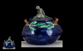 Majolica pot & Cover. Vibrant Blue with leaf decoration, lid of pot has a sitting monkey looking