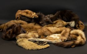 A Collection of Furs to include a ranch piece dark brown mink hat, various other fur hats, full