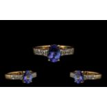 Ladies 9ct Gold Nice Quality Tanzanite and Diamond Set Dress Ring full hallmarks for 9ct. The oval