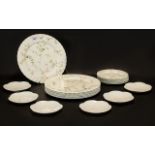 Wedgwood 'Campion' Porcelain comprising seven dinner plates and 7 side plate in white ground with