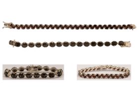 A Pair of Good Quality Silver Line Bracelets set with topaz. Each bracelet of estimated topaz 30