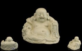 Chinese Sitting Buddha. Antique Chinese Buddha in off white porcelain, age related crazing, 5 inches