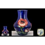 William Moorcroft Signed Bulbous Shaped Vase ' Big Poppy ' Design of Blue Ground. Signed to