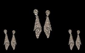 Diamond 'Folded Fabric' Drop Earrings, .5ct; the drops comprising closely set tapered baguette