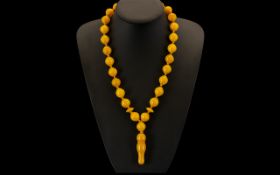 A Superb Single Strand Butterscotch Amber Beaded Necklace, Each Bead Individually Knotted and Well