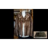 Mink Jacket in pale brown colour, with collar and reveres, hook and eye fastening, 3/4 sleeves and