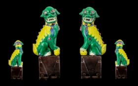 Late Ching Dynasty Pair of Famile Verte Temple Foo Dogs of Typical Form seated on square aubergine