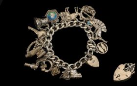 Vintage Good Quality Sterling Silver Charm Bracelet Loaded over 20 charms - all marked silver 925.