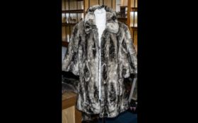 Ladies Faux Fur Fashion Jacket in brown/beige colour, elbow length sleeves, two slit pockets and two