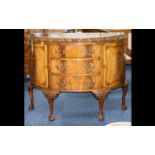 Early to Mid 20thC Bow Fronted Commode with three central drawers between two storage cabinets.