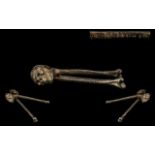 Skull & Crosssbones Cast Iron Nut Crackers with registration mark to the legbone. 6'' in length.