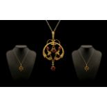 Art Nouveau 9ct Gold Garnet and Seed Pearl Set Pendant with drop attached to a 9ct gold chain.