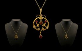 Art Nouveau 9ct Gold Garnet and Seed Pearl Set Pendant with drop attached to a 9ct gold chain.