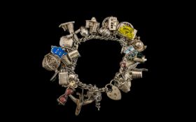 Vintage - Nice Quality Sterling Silver Charm Bracelet - Loaded with over 30 silver charms. All