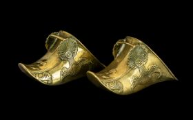 A Pair of 17th/18thC Spanish Brass Colonial Conquistador Stirrups with typical molded decoration.