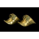 A Pair of 17th/18thC Spanish Brass Colonial Conquistador Stirrups with typical molded decoration.