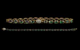 A Nice Quality and Attractive 9ct Gold Mystic Topaz Set Bracelet with diamond Set Clasp marked 9.