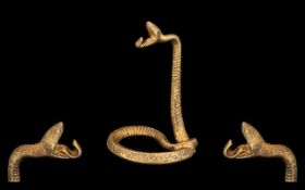 A Cast Iron Gilt Coloured Snake Watch Stand. Measuring 6 inches in height.