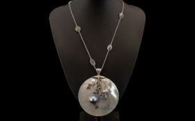 Mother of Pearl, Mabe Pearl and Labradorite Pendant Necklace, a large white mother of pearl circular