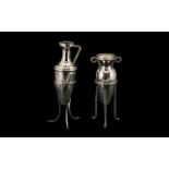 Two Silver Amphora Form Miniature Bud Vases Each Raised On Trefoiled Stand, One Of Planished