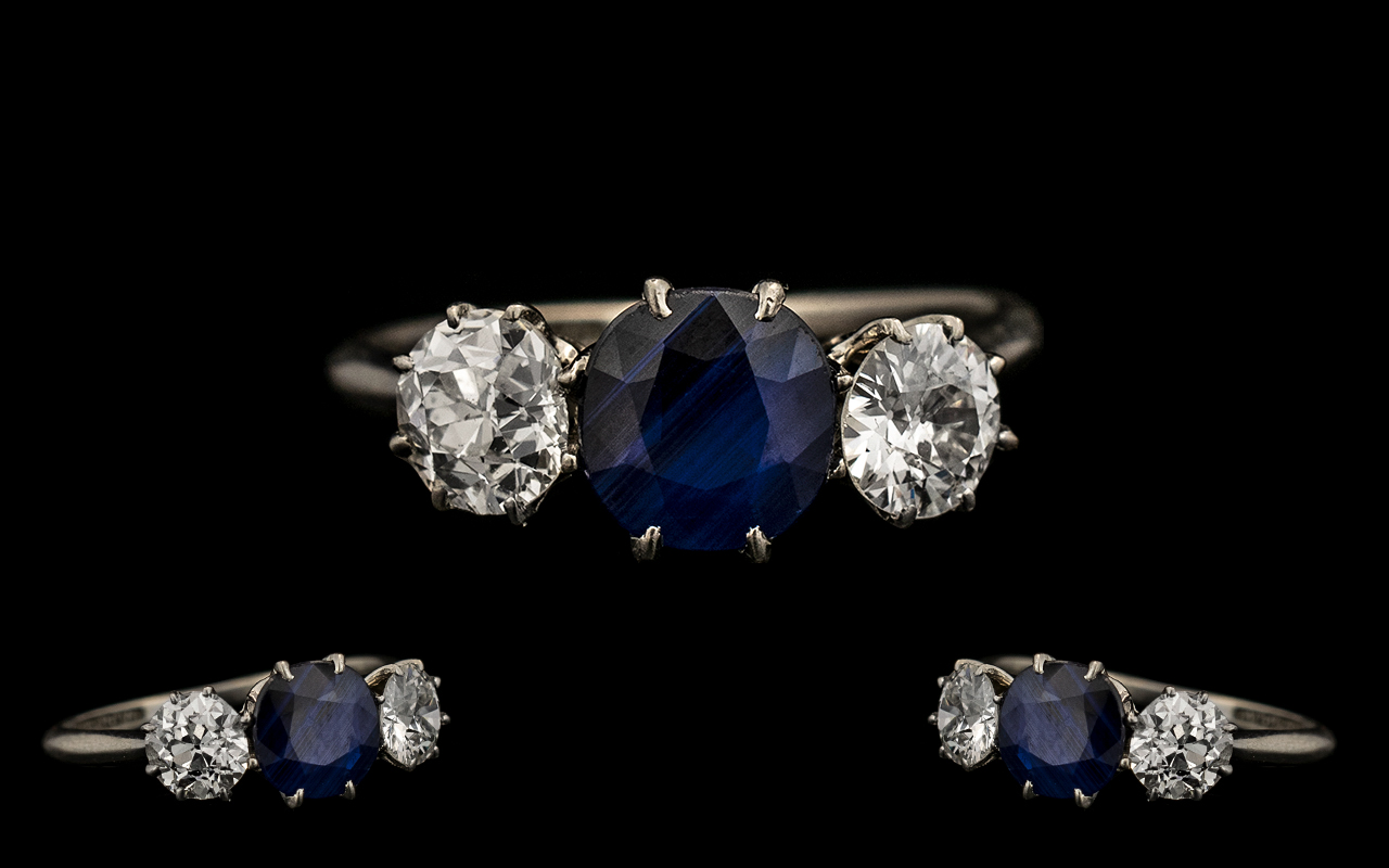 Platinum Set Superb Quality & Attractive Three Stone Sapphire & Diamond Set Dress Ring. Circa 1930s.