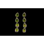 Peridot Long Line Drop Earrings, each earring comprising four, equally sized, luscious green