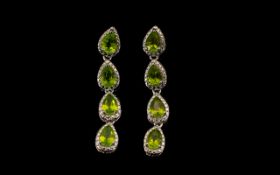 Peridot Long Line Drop Earrings, each earring comprising four, equally sized, luscious green