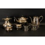 A Silver Plated Four Piece Tea and Coffee Set of plain form with reeded edge. Marked Harts EPNS.