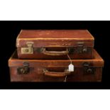 Early 20th Century Leather Suitcases. 2 leather suitcases with brass locks, 24 by 13 inches & 20