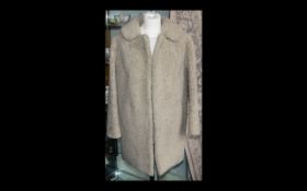 Ladies Curly Cream Lambs Wool Jacket. Three quarter length, long sleeves, hook and eye fastening,