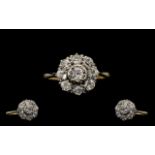 18 Carat Gold and Platinum Diamond Set Cluster Ring flower head setting. Circa 1920's. fully