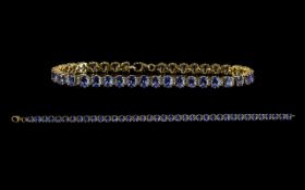 Ladies Good Quality Attractive Vermeil Tanzanite Set Line Bracelet set with forty tanzanites of