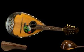 Fredo Albertini Italian Bowl Back Mandolin with eight strings and superb quality inlay work.