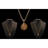 Ladies Contemporary Nice Quality & Pleasing Wheel-Shaped 9ct Gold Diamond & Topaz Set Pendant with