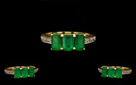 18ct Gold Attractive 3 Stone Emerald Ring - the three faceted step-cut emeralds of good colour.