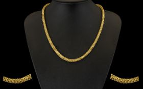 A Superb Quality 9ct Gold Well Designed Triple Crossover Link Necklace/Chain looks impressive.