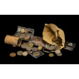 A Small Mixed Lot of Low Value Coins to include a collection of half pennies. To include a roll of