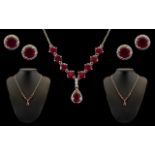 Boxed Set of Silver Necklace & Earrings set with ruby coloured stones and crystal decorative stones.