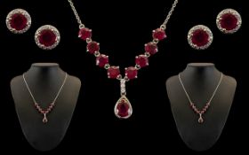 Boxed Set of Silver Necklace & Earrings set with ruby coloured stones and crystal decorative stones.