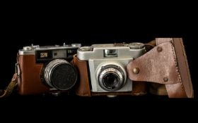 Two Vintage Cameras including Franka camera in tan leather case and shoulder strap; and Yashica