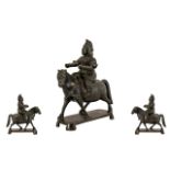 An Antique Japanese Bronze Horse and Rider finely chased on a rectangular base. Height 6 inches.