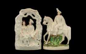 Pair of Staffordshire Flatbacks depicting a man on horseback and a seated courting couple. Please