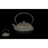 An Antique Japanese Cast Iron Tea Kettle