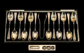 A Boxed Set of 12 Silver Teaspoons with