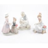 A Lladro figure of a young girl on a telephone and seven other Nao figures of children (8)
