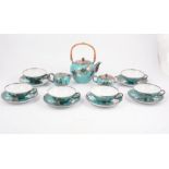 A six-piece Bavarian porcelain tea set with silver overlay