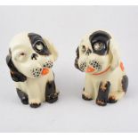 Seven Crown Devon "Perky Puppy" figures, five with glass eyes, two 23cm doorstop figures, one