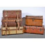 Five large vintage travelling trunks.