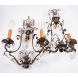 A pair of twin arm metal wall light fittings with faceted and coloured glass lustres